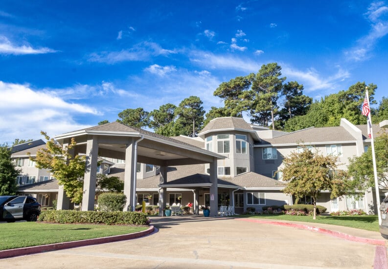 Exterior Main Building with Drop off Driveway of a Senior Living Facility Exterior Main Building with Drop off Driveway of a Senior Living Facility