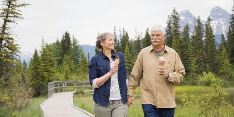 Senior Couple Walking with Ice Cream at Independent Living Facility