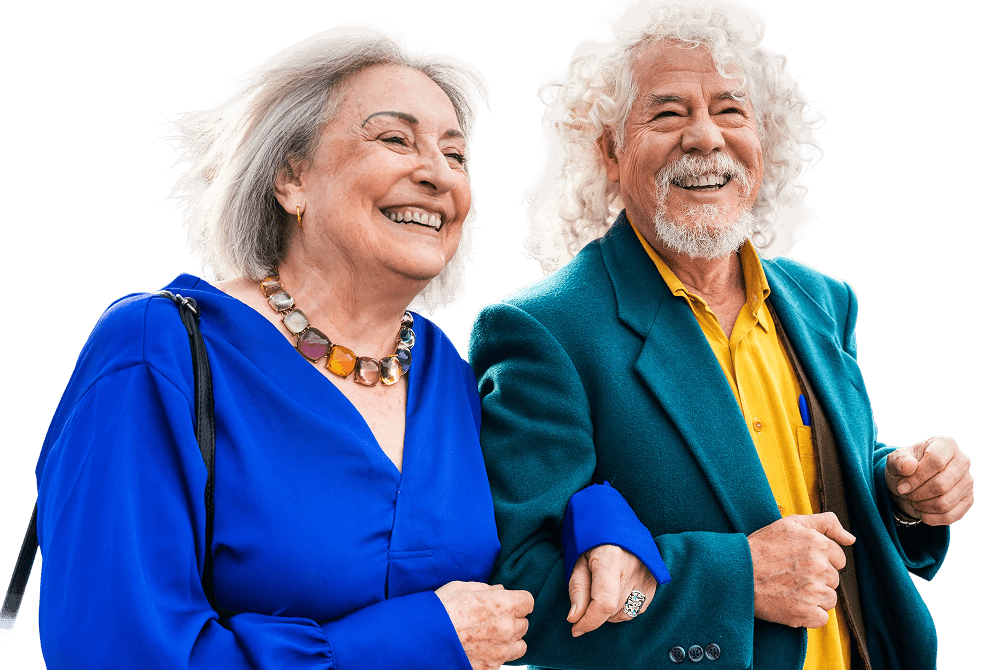 Stylish Elderly Couple Laughing and Walking Arm in Arm at an Independent Living Community Stylish Elderly Couple Laughing and Walking Arm in Arm at an Independent Living Community