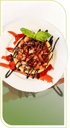 Gourmet Pasta Dish Garnished with Basil and Balsamic Drizzle at an Independent Living Facility