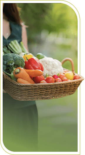 Woman Holding Basket of Fresh Colorful Vegetables at an Independent Living Facility