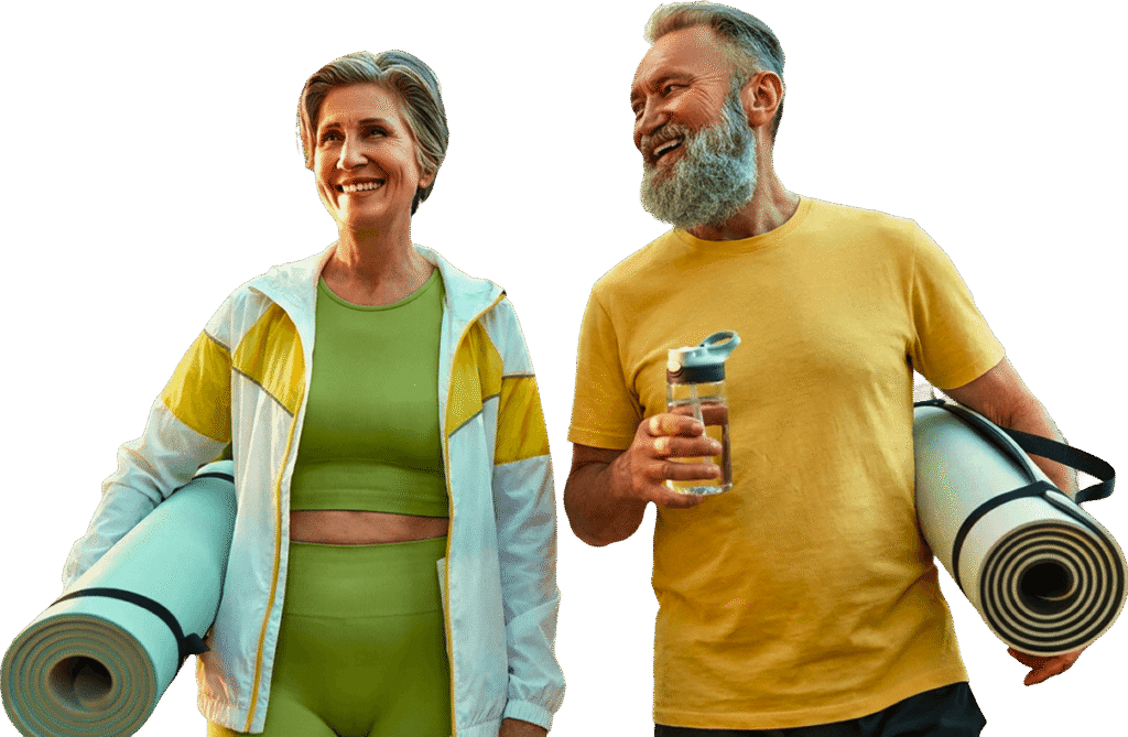 Smiling Elderly Couple Carrying Yoga Mats and Water Bottle at an Independent Living Community Smiling Elderly Couple Carrying Yoga Mats and Water Bottle at an Independent Living Community