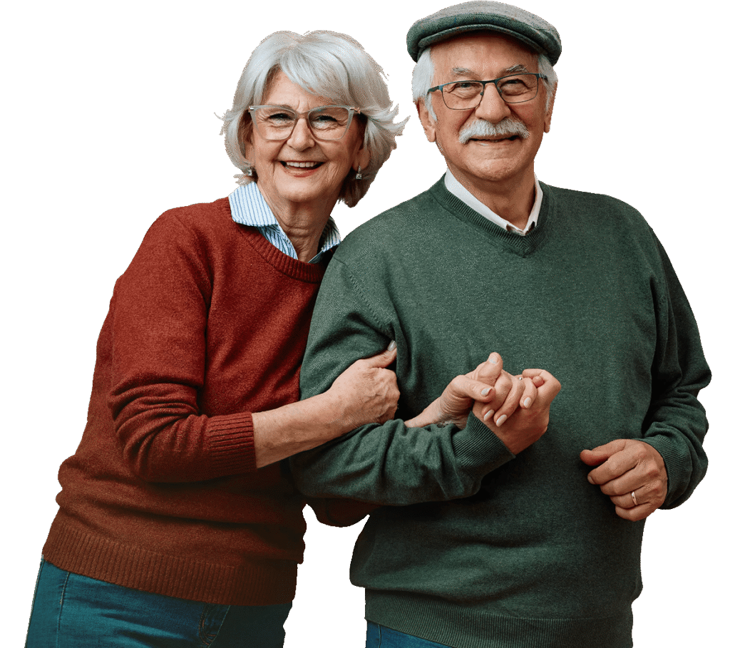 Cheerful Elderly Couple Walking Arm in Arm Together at an Independent Living Facility Cheerful Elderly Couple Walking Arm in Arm Together at an Independent Living Facility