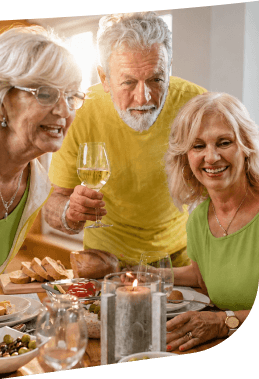 Elderly Friends Toasting with Wine during a Festive Meal at an Independent Living Community Elderly Friends Toasting with Wine during a Festive Meal at an Independent Living Community