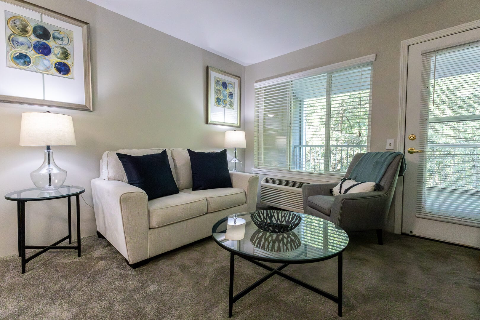 Comfortable Furnished Living Room with Sofa and Natural Light at an Independent Living Community