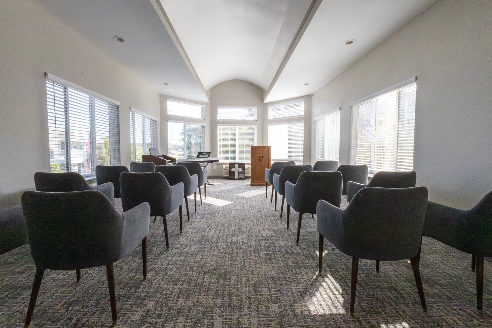 Bright Chapel Room with Piano and Lectern for Worship at an Independent Living Facility