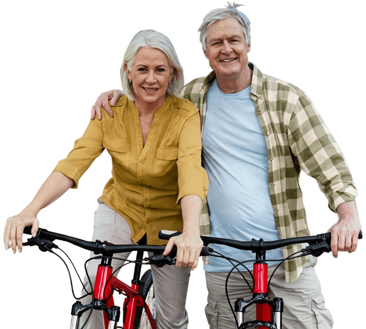 Smiling Elderly Couple Standing Together with Bicycles Outdoors at an Independent Living Facility Smiling Elderly Couple Standing Together with Bicycles Outdoors at an Independent Living Facility
