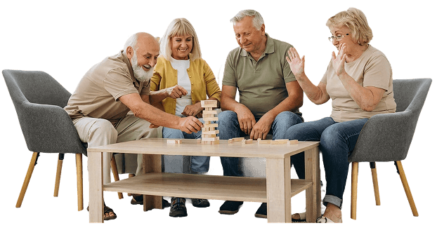 Group of Elderly Friends Playing a Wooden Block Stacking Game at an Independent Living Community Group of Elderly Friends Playing a Wooden Block Stacking Game at an Independent Living Community