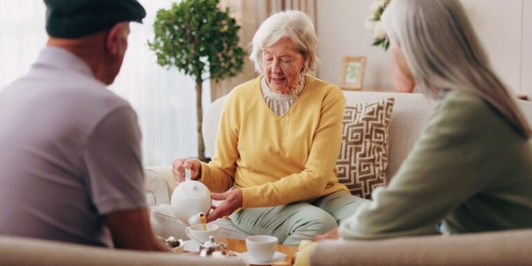 Senior Residents Enjoying Tea Together in the Independent Living Facility's Shared Lounge